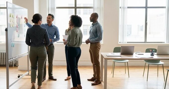 Group of people meeting in modern bright office environment