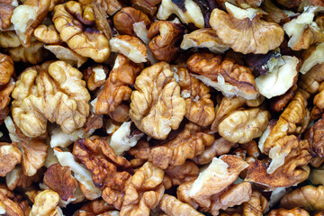 Obraz premium A lot of peeled walnuts close-up. Texture of walnuts