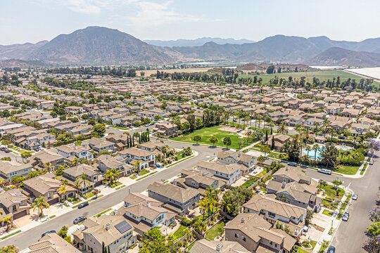 Camarillo, California &ndash; July 11, 2024: Aerial Drone Camarillo City View Photo toward Pleasant Valley Rd with House, Home, Town, Street, Road, Cityscape, Townhouse, Townhome, Mountain

