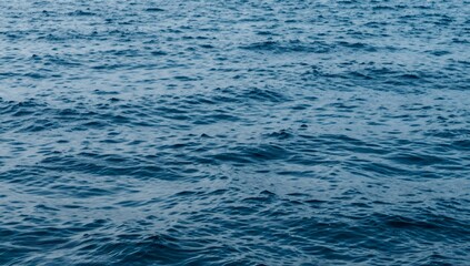 Deep blue sea with gentle ripples creating a textured pattern across the surface