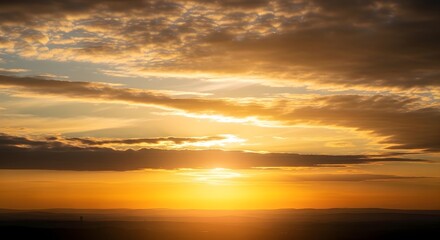 Fototapeta premium Dramatic sunset sky with clouds and bright sun golden hour background