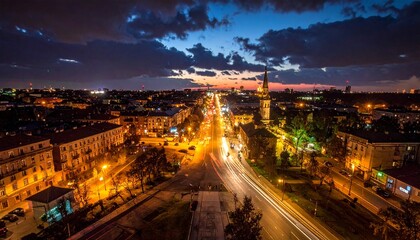 Fototapeta premium Cityscape Night View with Illuminated Buildings.