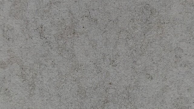 Seamless rotating loop motion of grey concrete stone texture background.