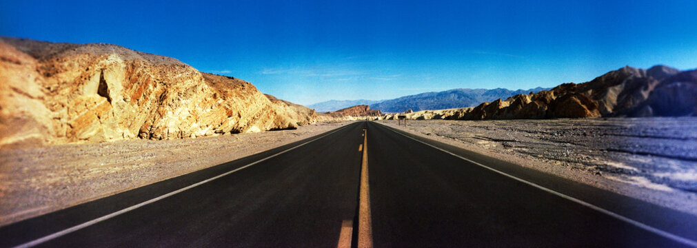 Panoramic view of road going through Death Valley National Park, California, Southwest, United States