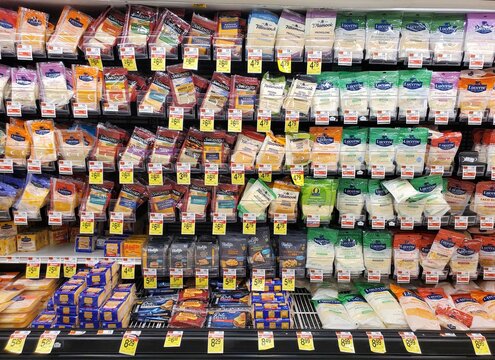 Delaware, U.S - Feb 15, 2026 - Assorted sliced and shredded cheeses from multiple brands, offering diverse varieties for cooking, snacking, and meal preparation.