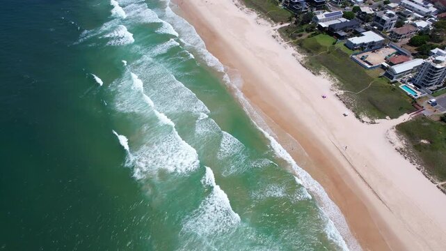 Turquoise Waves Rolling Onto Sandy Mermaid Beach - Scenic Coastal Suburb In Gold Coast, Queensland. aerial shot