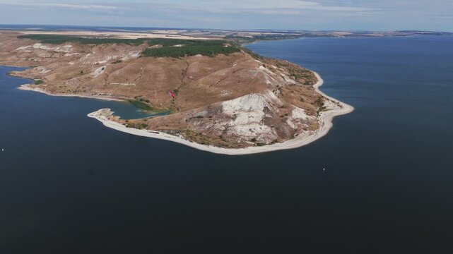 Paraplane flying over podvalskie chalk hills and don river