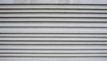 Horizontal concrete siding shows a minimalist pattern and provides interesting texture