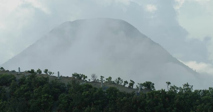 Fog and Volcanic Smoke Surrounding Gunung Gede, West Java