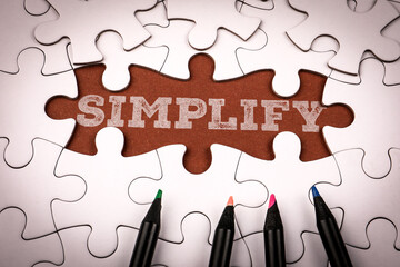 Simplicity Text On Brown Puzzle Piece Background