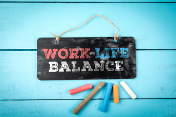 Work-Life Balance Chalkboard Sign On Blue Wooden Background