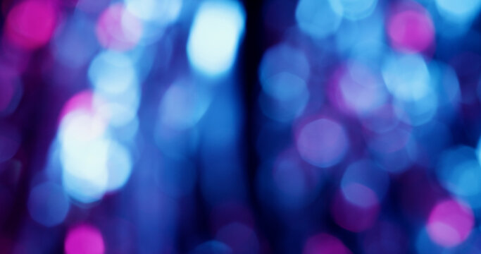 Blur circles. Neon color light. Blue purple pink round shiny texture glimmer optical illuminated flare on art abstract bokeh background.