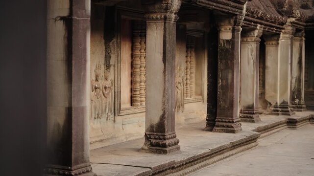 Carved columns and bas relief inside Angkor Wat Cambodia