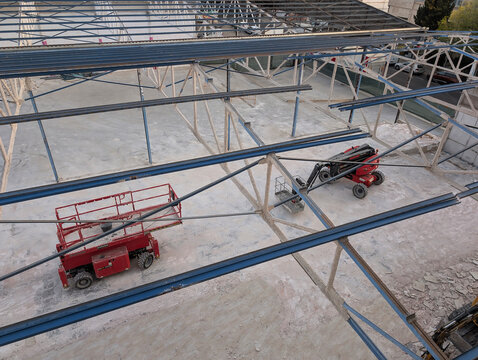 Palma de Mallorca, Spain &ndash; April 25, 2025: Manitou construction platforms inside dismantled warehouse structure at building site in Son Castell&oacute; industrial estate.
