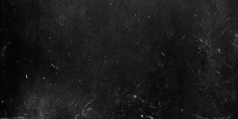 Fototapeta premium a close up of a black surface with white specks and scratches on it looking like a dirty or worn texture