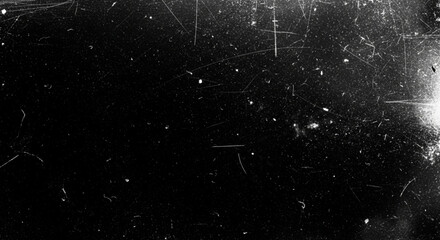 A heavy texture background mimicking old film or scratched glass with white dust particles, speckles, and linear scratches on a black background.