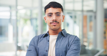 Fototapeta premium Business, man and serious with portrait in office for news reporting, creative internship or about us. Journalist, intern and glasses at publishing agency for career opportunity, copywriting or media