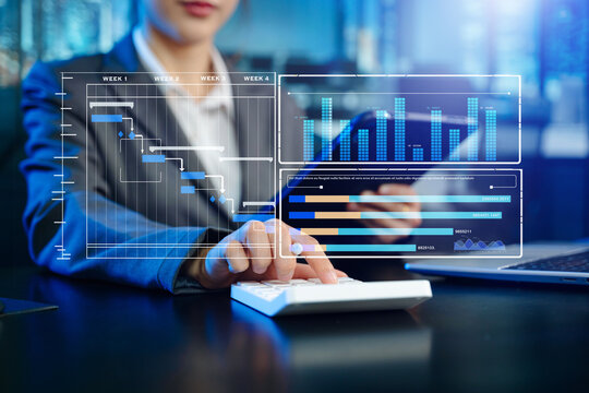 Business woman hand Project manager working and update tasks and Gantt chart scheduling virtual diagram.with smart phone