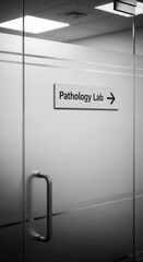 Clinical Setting Photography: Frosted Glass Door with Pathology Lab Sign, Monochromatic Aesthetic