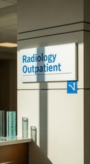 Obraz premium Hospital Corridor View Featuring Radiology Outpatient Sign With Contemporary Design and Sunlight