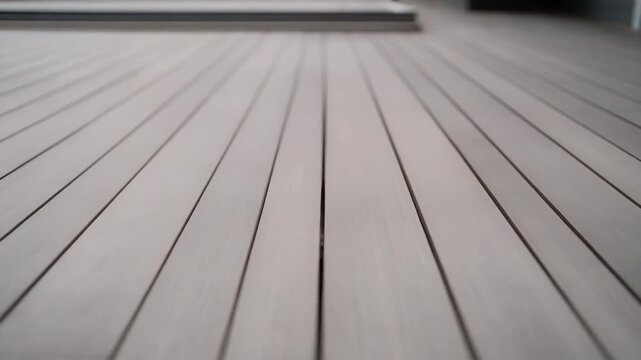 Grayscale timber deck planks create strong parallel lines and textured grain, a minimalist horizontal wooden surface ideal as a clean architectural background or modern flooring detail