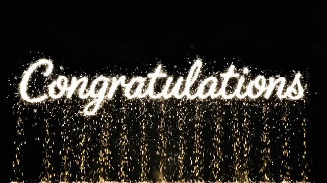 Celebratory sparks forming congratulations on black background