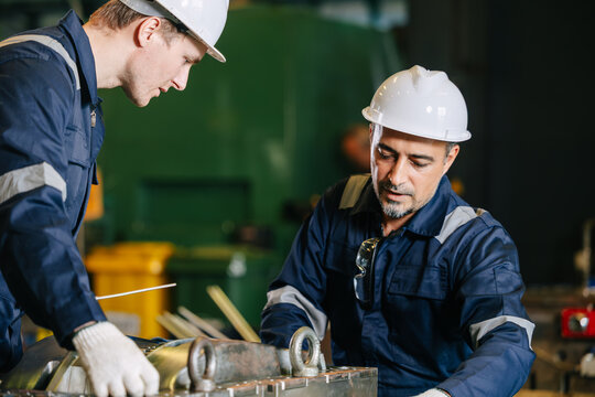 Engineer worker team service injection mold, Professional men work in die casting plant mold service