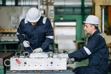 Engineer worker team service injection mold, Professional men work in die casting plant mold service