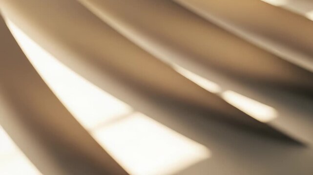Smooth beige paper forming gentle curves with natural light creating graphic shadow patterns, conveying feelings of calm artistry and minimalistic design