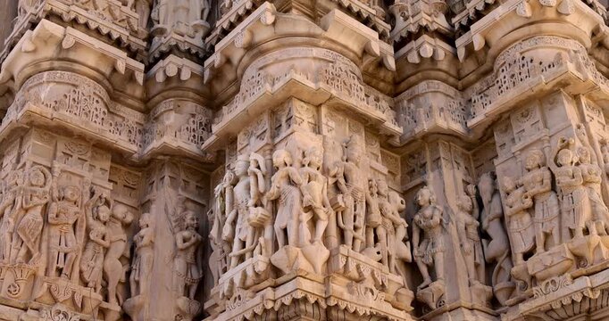 Intricate carvings on ancient hindu temple wall, Jagdish temple in Udaipur, Rajasthan, India.