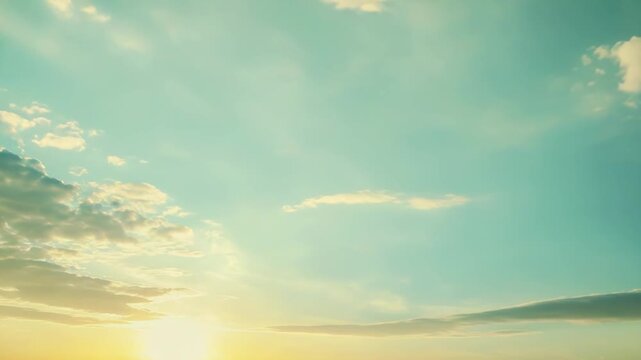 Golden sun illuminating a tranquil blue sky with soft, scattered clouds, creating a peaceful backdrop for concepts of freedom, hope, and new beginnings