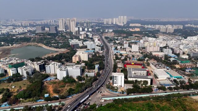 Drone shot over HITEC City&rsquo;s arterial road&mdash;linking IT parks, towers, and business hubs at the heart of Hyderabad&rsquo;s innovation district.