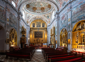 Fototapeta premium Sevilla, Spain - 4 Sep 23: Baroque church nave and altar at Hospital de los Venerables