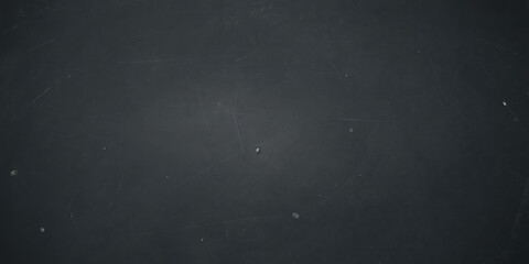 Fototapeta premium Grungy black slate surface with fine scratches and weathered texture, high-resolution dark background for culinary backdrops, teaching, and professional presentations.