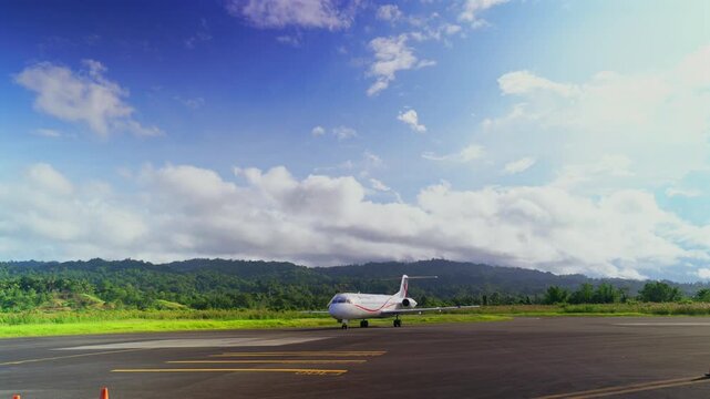 Wewak Airfield Boram Airport WWK Papua New Guinea PNG Papua Niugini Air Niugini PNG Air Airliner Fokker airplane terminal runway taxiway passenger domestic direct flights blue sky sunny pan