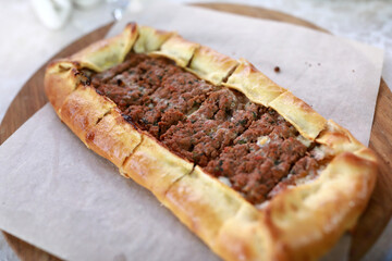 Traditional Turkish pide with savory ground meat filling