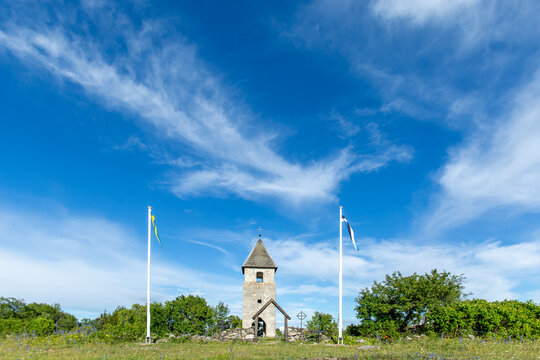 Small Pakri (V&auml;ike-Pakri, Lilla R&aring;g&ouml;) chapel in Estonia surrounded by greenery on a sunny summer day