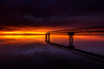Obraz premium Bridge at Sunset with Golden Sky