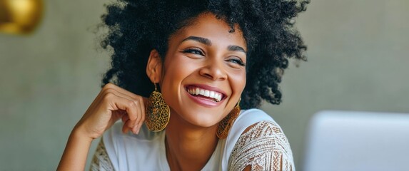 Naklejka premium A beautiful african american woman with a vibrant smile, wearing elegant earrings and happy.
