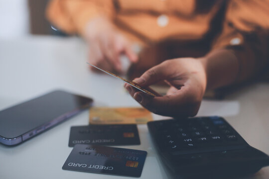 Online payment, Hands of woman holding a credit card and using smart phone for online shopping