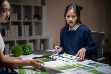 Fototapeta premium Women discussing sustainability design and esg in office