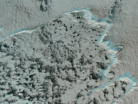 Icy patterned landscape captured from a drone above Lake Michigan