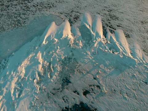 Ice formations and sunset shadows captured by drone