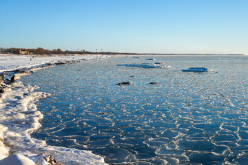 Frozen Baltic Sea Shoreline in Liepaja Latvia with Drift Ice and Snowy Winter Coast © Zigmunds
