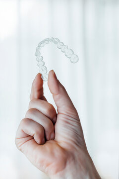 Orthodontists working in a professional dental laboratory with invisible aligners