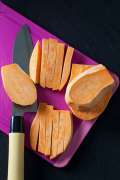 Sliced and sweet potato on chopping board