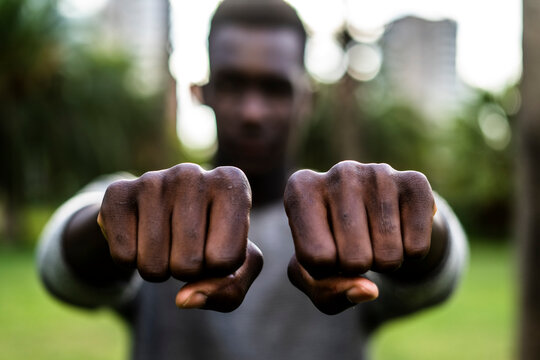 Young man showing his fists
