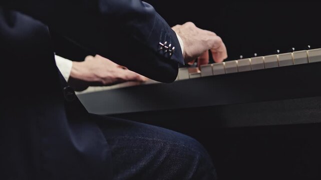 Expressive musician performing with delicate finger and wrist motion