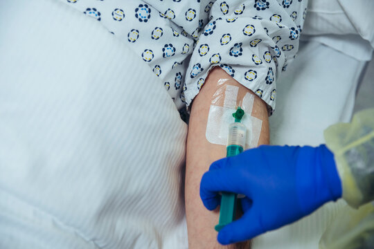 Close-up of patient in hospital receiving an infusion