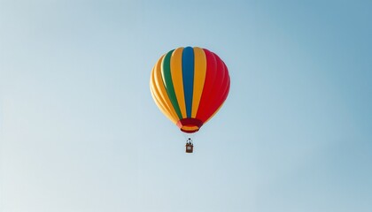 Fototapeta premium Colorful hot air balloon flying high in a clear blue sky with copy space